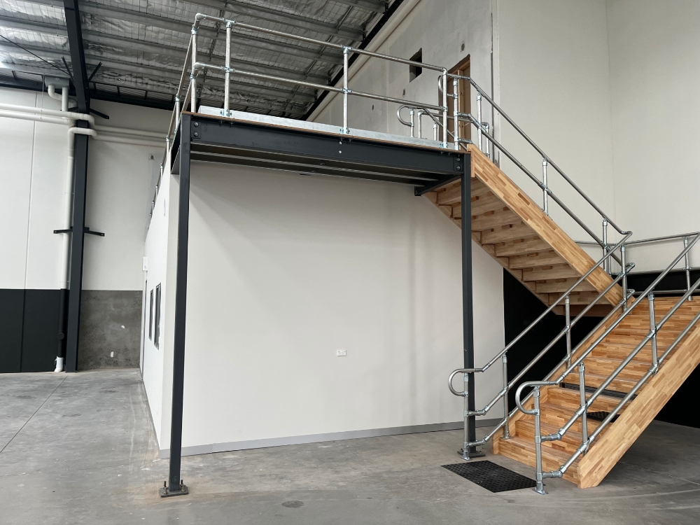 Interclamp standard key clamp handrail and DDA compliant handrail installed on a mezzanine floor